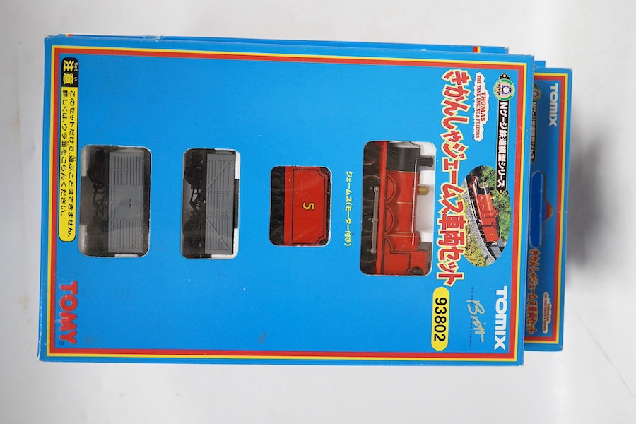 Four boxed Tomix (by Tomy) N gauge railway Thomas the Tank Engine & Friends train packs, comprising of three locomotives and rolling stock (one locomotive missing): James (93802), Henry (93805), Percy (93808) and Thomas